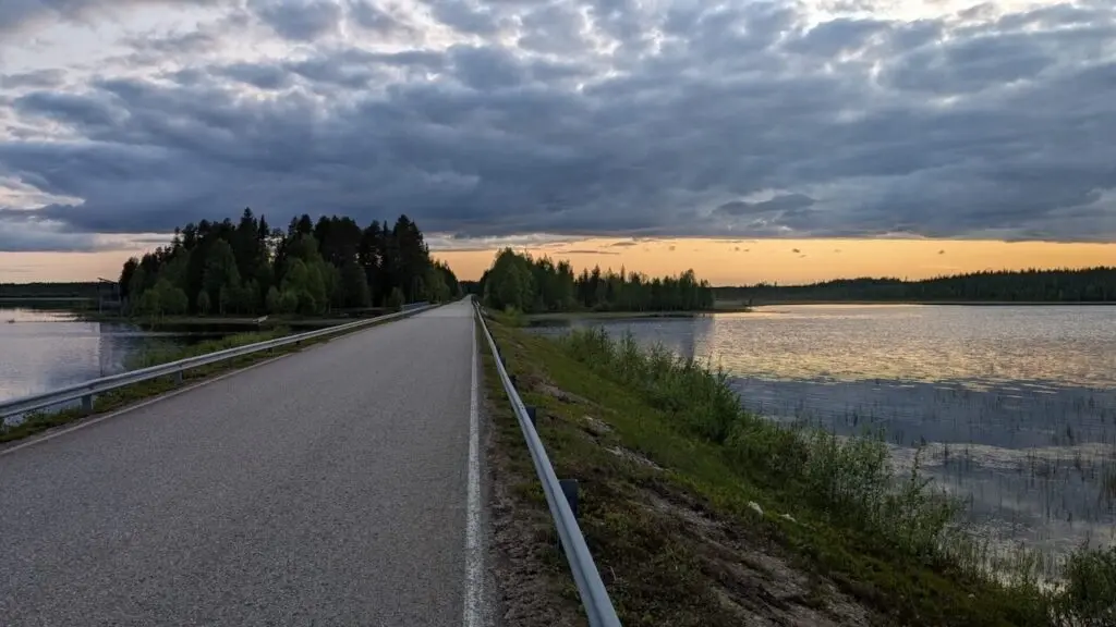 Panoramic view of a Finnish cycling route through forest and lakeside terrain used by Ecorefine groups